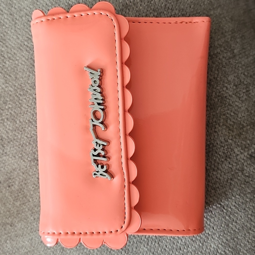 coral wallet with scalloped edges